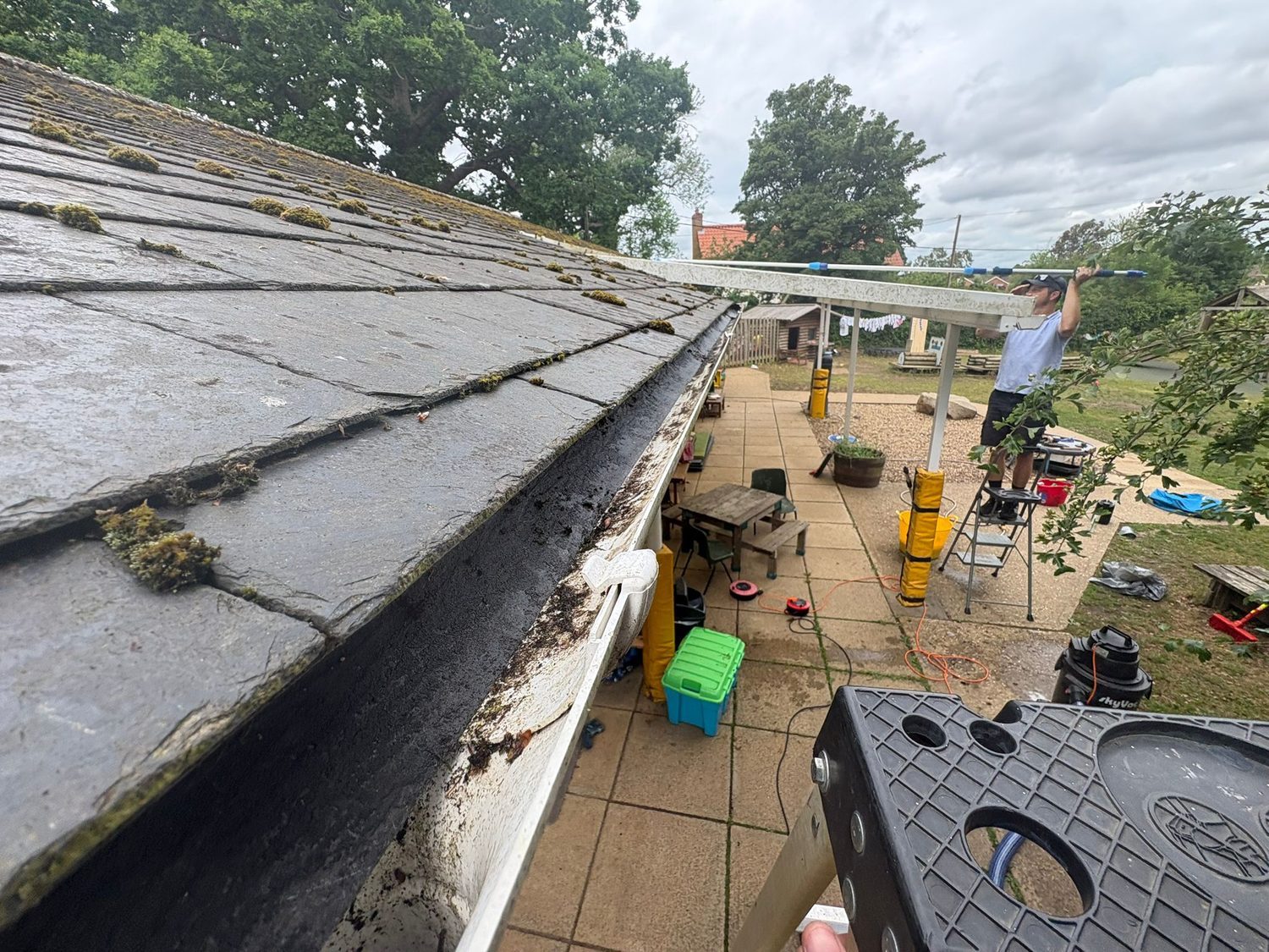 Clearing a gutter with a pole