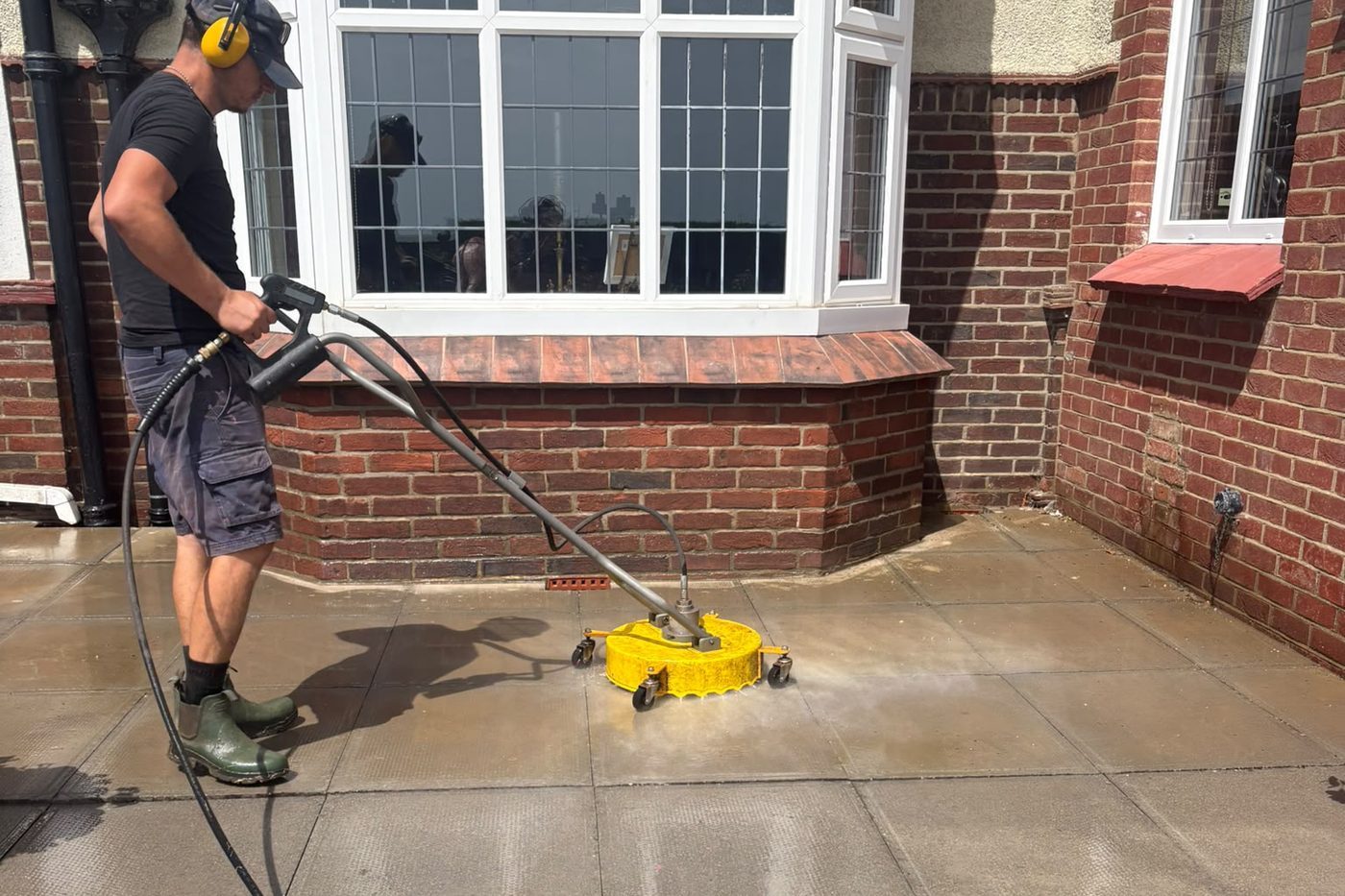 Pressure washing a patio with a surface cleaner